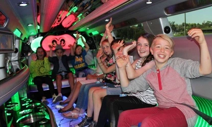 Luxury birthday limousine service with elegant interior and party lighting.